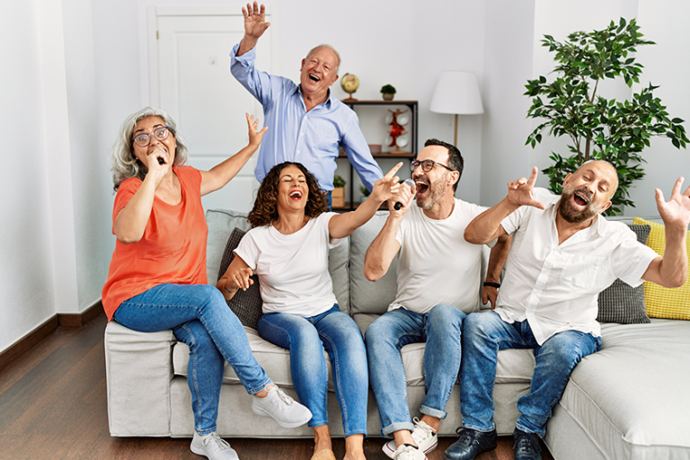 group middle age friends having party singing song