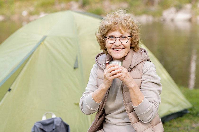 happy mature female hiker hot drink happy mature female hiker hot drink