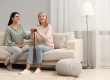mature lady with walking cane and young woman