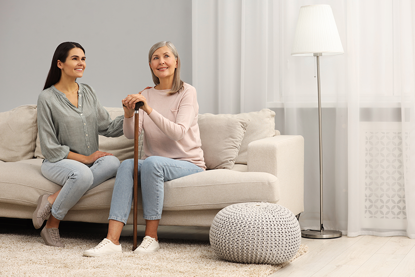 mature lady with walking cane and young woman mature lady with walking cane and young woman