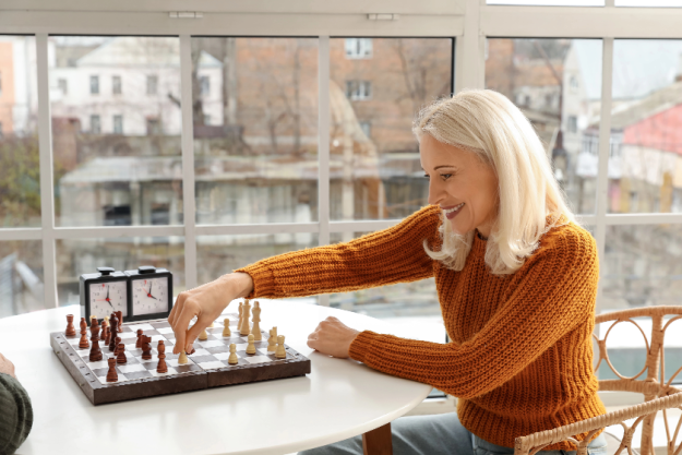 mature woman her husband playing chess