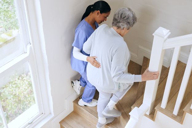 nurse senior woman support stairs nurse senior woman support stairs