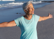 senior caucasian woman enjoying time beach