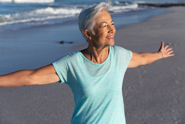 senior caucasian woman enjoying time beach senior caucasian woman enjoying time beach