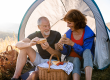 senior tourist couple sitting in nature